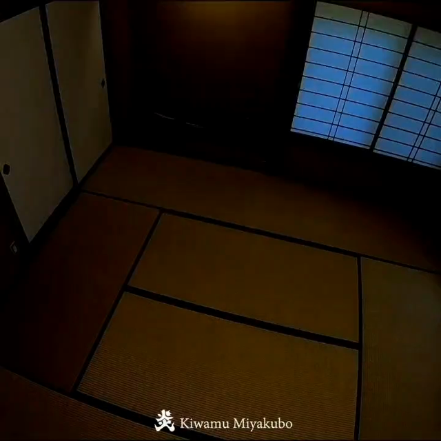 A real video of a man fading into a room, pulling out a Japanese sword (Katana) from its shaft, then flames and sparkles going everywhere. The video is by Kiwamu Miyakubo who is a flame artist.