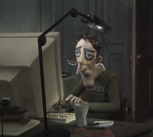 Ein Screenshot vom Film Coraline auf dem der Vater komplett ermüdet und enttäuscht vor einem alten Computer in einer ungesunden Pose sitzt.