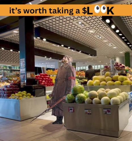 An image of a bolshevik soldier in a fancy bourgeoisie supermarket looking up in despair with the text above him reading “it's worth taking a $look”. 

The bolshevik soldier is from the painting “It Has Come to Pass”, also known as “Inevitable” and “Bolshevik soldier Stands Guard in Winter Palace” by Soviet Artist Sergei Lukin from 1958. It's supposed to portray the shock a regular working class person had upon seeing the riches of the Tsars in Russia. The modern version of that feeling is ente…